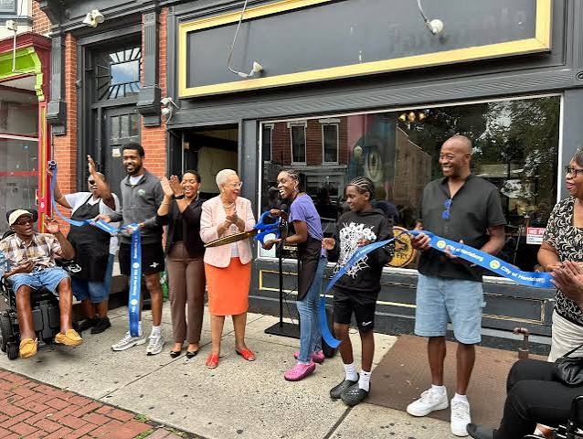 Ribbon cutting outside Aunt HOCKER's Fish Fry on opening day in Midtown Harrisburg